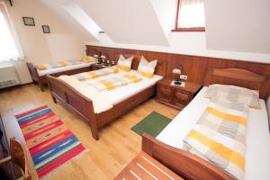 מיטה או מיטות בחדר ב-Tourism Tompa
