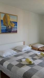 Кровать или кровати в номере Guesthouse Familija Tariba