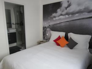 Postel nebo postele na pokoji v ubytování Hotel Côte d'Opale