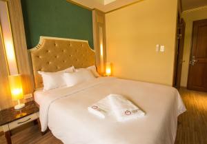 Katil atau katil-katil dalam bilik di Appleton Boutique Hotel Mactan Cebu