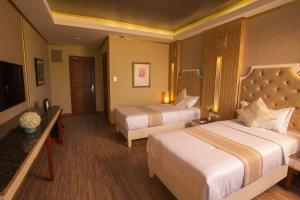 Katil atau katil-katil dalam bilik di Appleton Boutique Hotel Mactan Cebu