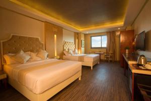 Postel nebo postele na pokoji v ubytování Appleton Boutique Hotel Mactan Cebu + 18 fotografií