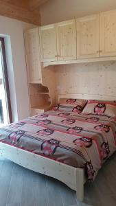 Giường trong phòng chung tại Garnì Fobbie