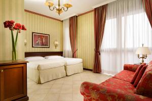 Postel nebo postele na pokoji v ubytování UNAWAY Hotel & Residence Contessa Jolanda Milano