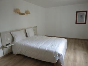 Postel nebo postele na pokoji v ubytování Hotel Côte d'Opale