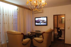TV a/nebo společenská místnost v ubytování Hotel Adria