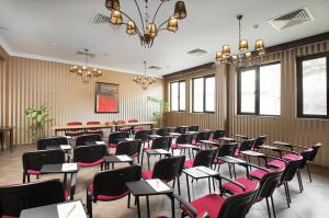 a room filled with chairs and tables and windows at Balneo Complex Saint Spas in Velingrad +62 photos