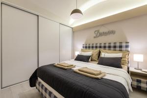 A bed or beds in a room at H75 Apartments Kosice Centre