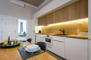 A kitchen or kitchenette at H75 Apartments Kosice Centre