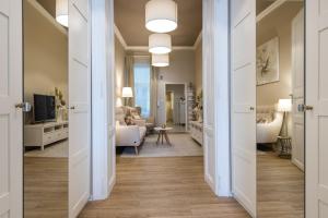 A bed or beds in a room at H75 Apartments Kosice Centre