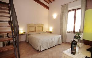 Ένα ή περισσότερα κρεβάτια σε δωμάτιο στο Bacco a Petroio