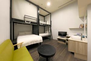 Postel nebo postele na pokoji v ubytování Place‧X Hotel