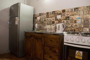Cuisine ou kitchenette dans l'établissement Duplex Macuco