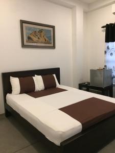 Postel nebo postele na pokoji v ubytování US Motel Colombo