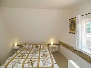 A bed or beds in a room at The Cottage 