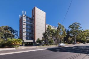 a tall building on the side of a street at Royal Pacific Hotel in Sydney