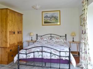 A bed or beds in a room at The Field Barn 