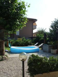 a group of blue inflatable boats sitting in a yard at B&B La Corte in Casorate Primo