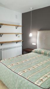 A bed or beds in a room at Puerta del Arco