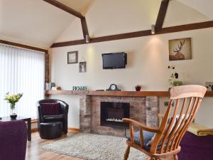 A television and/or entertainment center at Plumtree Barn At Gumburn Farm 