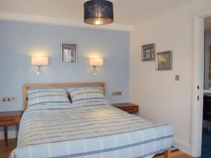 A bed or beds in a room at Lower Barns Fold 