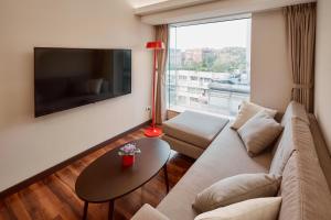 Televiisor ja/või meelelahutuskeskus majutusasutuses Eastin Taipei Hotel