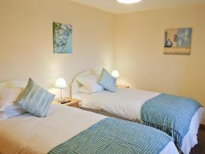 A bed or beds in a room at The Bull Pen 