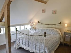 A bed or beds in a room at The Tractor Shed 