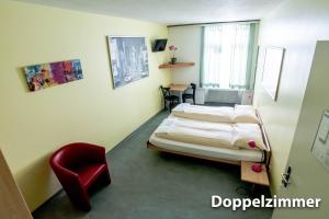 Voodi või voodid majutusasutuse Hotel & Backpackers Zak Schaffhausen toas