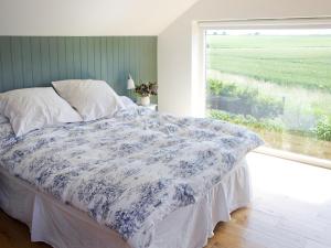 A bed or beds in a room at Puddle Barn 
