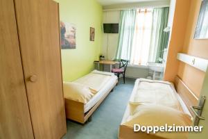 Voodi või voodid majutusasutuse Hotel & Backpackers Zak Schaffhausen toas