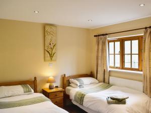 A bed or beds in a room at Ash 