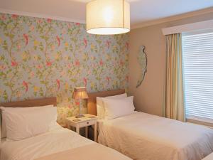 A bed or beds in a room at Seagrass 