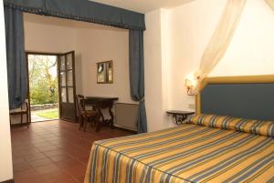 Posteľ alebo postele v izbe v ubytovaní Relais Borgo Di Toiano