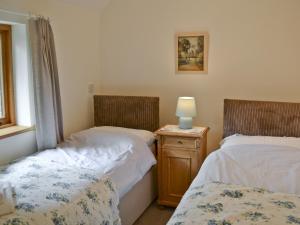 A bed or beds in a room at The Granary 