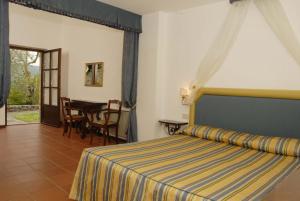 Posteľ alebo postele v izbe v ubytovaní Relais Borgo Di Toiano