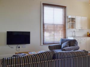 A television and/or entertainment center at Claremont House - Suite 1 