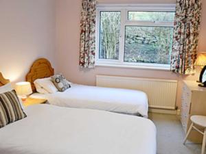 A bed or beds in a room at Fisherbeck Park 