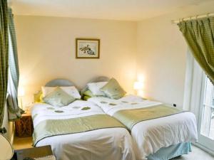 A bed or beds in a room at The Keep 