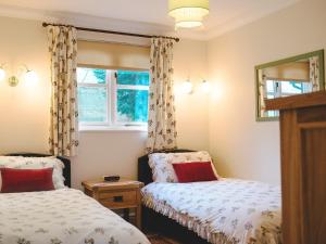 A bed or beds in a room at The Pottery 