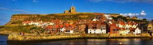 a town on a hill with a castle on top of it at Glen View B & B in Whitby