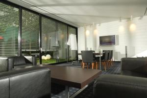 TV a/nebo společenská místnost v ubytování Ara Hotel Comfort