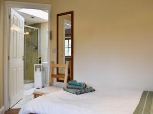 A bed or beds in a room at Ash 