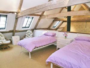 A bed or beds in a room at North Barn 