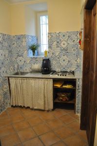 a kitchen with a sink and a counter top at L'antico Giardino in Vietri sul Mare