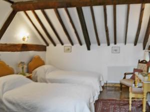 A bed or beds in a room at Tiplen Green Barn 