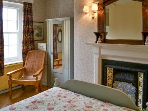 A bed or beds in a room at Tanamera 