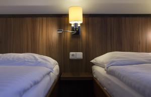 Postel nebo postele na pokoji v ubytování Hotel Selsky Dvur