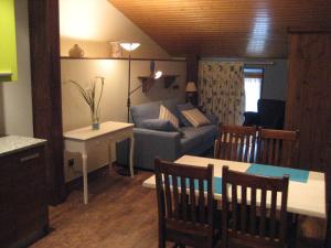 a living room with a couch and a table at Apartamentos la Demanda in Ezcaray