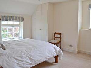 A bed or beds in a room at North House 